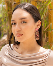 Load image into Gallery viewer, Model showcasing stylish earrings with a unique design