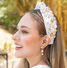 Load image into Gallery viewer, A woman displaying trendy summer fashion accessories including a headband and earrings.