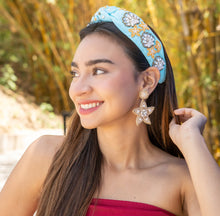 Load image into Gallery viewer, Young woman wearing a blue embellished headband and star-shaped earrings in a sunny outdoor setting.