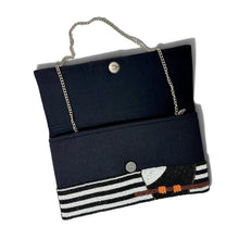 Load image into Gallery viewer, Interior of hand-beaded toucan clutch showing magnetic closure and chain strap