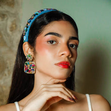 Load image into Gallery viewer, A model showcasing elegant multicolor earrings with a stylish headband.