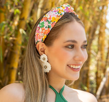 Load image into Gallery viewer, Fashionable woman with a vibrant headband and stylish earrings posing outdoors.