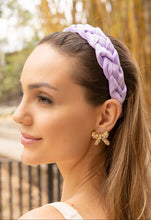 Load image into Gallery viewer, Fashionable woman showcasing a purple headband and embellished earrings.