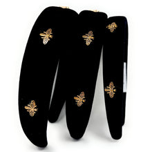 Load image into Gallery viewer, A velvet black headband with decorative golden bees.