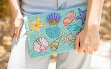 Load image into Gallery viewer, A summer clutch bag with intricate beadwork of marine life.