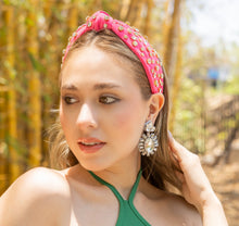 Load image into Gallery viewer, Vibrant summer accessories including a pink headband and statement earrings.
