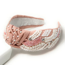 Load image into Gallery viewer, Luxe pink embellished headband featuring pearl detailing, shimmering beadwork, and a chic twisted knot design.