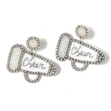 Load image into Gallery viewer, Close-up fashion portrait showcasing handcrafted crystal statement earrings with intricate beadwork and shimmering details.