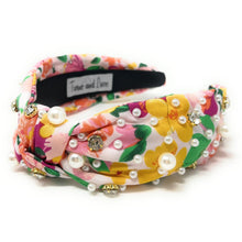 Load image into Gallery viewer, Bright floral print headband decorated with pearls and crystals paired with oversized white floral earrings.