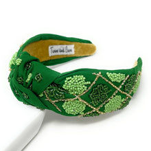 Load image into Gallery viewer, headbands for women, green knotted headband, headband style, top knot headband, green top knot headband, lucky charm headband, lucky charm hair band, green knot headband, top knotted headband, St Patrick’s headband, handmade headbands, top knotted headband, hand bead knotted headband, Clover leaf hair band for women, Hand bead St. Patrick’s headband, statement headbands, embellished headband, chic headband, clover leaf knot headband, st paddy’s headband, green hair accessories, four leaf clover headband