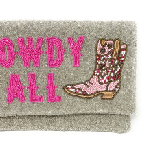 Load image into Gallery viewer, Handcrafted beaded clutch featuring “Howdy Y’all” lettering and a colorful cowboy boot design, held by a model outdoors.