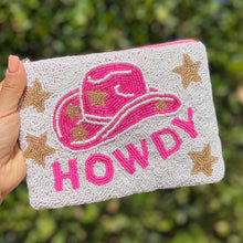 Load image into Gallery viewer, Hand beaded pouch purse with a pink 'HOWDY' text and a cowboy hat design, surrounded by gold stars on a beige background
