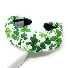 Load image into Gallery viewer, This fashionable green four leaf clover knot headband is perfect for any occasion. Crafted from lightweight and comfortable material, it&#39;s designed to be one size fits most. Enjoy all-day comfort without sacrificing style.