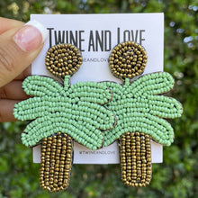 Load image into Gallery viewer, beaded earrings, statement earring, tropical beaded earrings, seed bead tropical earrings, summer earrings, best seller earrings, must have accessories, best seller accessories, friends gifts, best friend birthday gift, earrings lover, latest earrings, bead earrings,handmade sunflower earrings, sunflower earrings, birthday gift for her, birthday gift, best friend gift, palm trees lover gift, palm tree gifts, palm tree party theme, green earrings, beach accessories, palm tree party, tropical party theme