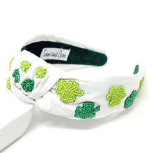 Load image into Gallery viewer, headbands for women, green knotted headband, headband style, top knot headband, green top knot headband, lucky charm headband, lucky charm hair band, green knot headband, top knotted headband, St Patrick’s headband, handmade headbands, top knotted headband, hand bead knotted headband, Clover leaf hair band for women, Hand bead St. Patrick’s headband, statement headbands, embellished headband, chic headband, clover leaf knot headband, st paddy’s headband, green hair accessories, four leaf clover headband
