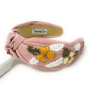 Our new Yeehaw Jeweled Knot headband will steal the show no matter what you have on. Available in pink.