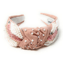 Load image into Gallery viewer, Handmade blush satin headband with intricate pearl embellishments, rhinestones, and soft pink beaded accents.