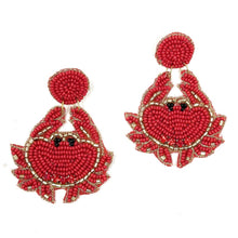 Load image into Gallery viewer, Statement crab earrings featuring vibrant red seed beads, sparkling embellishments, and whimsical seaside charm displayed on a Twine and Love card.