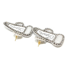 Load image into Gallery viewer, Sophisticated silver earrings with rhinestone accents, styled with a classic black outfit for a timeless and polished appearance.